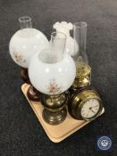A tray containing a brass oil lamp with glass chimney and shade together with a converted brass oil