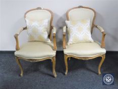 A pair of French style salon armchairs