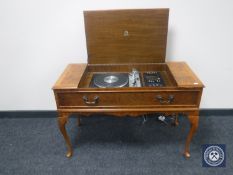 A mid 20th century mahogany and walnut cased Dynatron music centre with Goldring turn table
