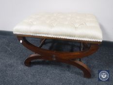 A reproduction dressing table stool