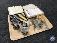 A tray of cased and loose cutlery,