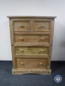 A Mexican pine five drawer chest