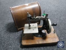 A mid 20th century cased child's sewing machine