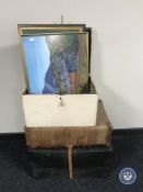 A painted pine storage box containing three framed pictures, ties,