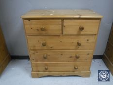 A pine five drawer chest and a blanket box