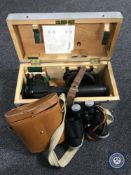 A military scope in fitted pine box together with a set of leather cased binoculars