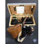 A military scope in fitted pine box together with a set of leather cased binoculars