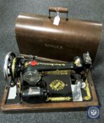 A vintage oak cased Singer sewing machine