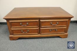 A reproduction mahogany storage coffee table, width 122 cm.