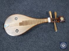 A Chinese four-stringed musical instrument CONDITION REPORT: The instrument is