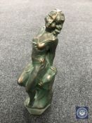 An Art Deco style chalk figure of a reclining lady