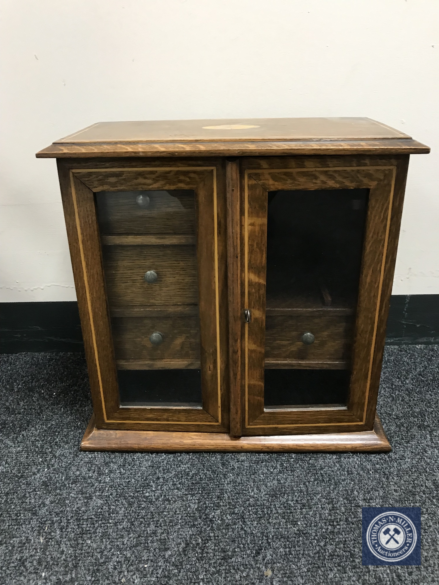 A Victorian inlaid oak smoker's cabinet