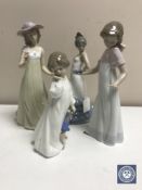 Four Nao figures of ladies (a/f)