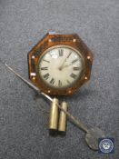 An antique timepiece with mother of pearl inlaid case together with two weights and pendulum