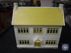 A mid twentieth century dolls house with large quantity of furniture and accessories