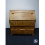 A continental oak writing bureau