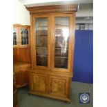 A late 19th century walnut glazed door bookcase CONDITION REPORT: 214cm high by