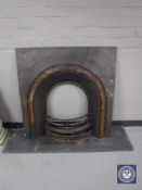 A cast iron fire insert and a slate hearth