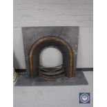 A cast iron fire insert and a slate hearth