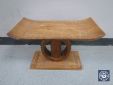 An Eastern mahogany stool