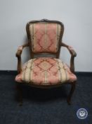 A continental armchair on cabriole legs in Regency style fabric