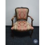 A continental armchair on cabriole legs in Regency style fabric