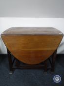 An Edwardian mahogany gate leg table