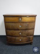 A continental mahogany bowfront four drawer chest