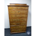 A late 19th century mahogany and walnut seven drawer chest on chest