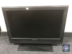 A Sony Bravia 26" LCD TV with remote