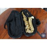 A brass Alpha Saxophone by Trevor James in a fitted case