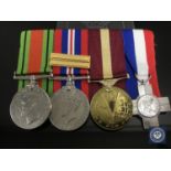 A group of four medals including Defence Medal, War Medal with Gloucestershire Regt.