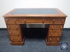 A Victorian mahogany child's writing desk fitted nine drawers