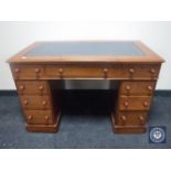 A Victorian mahogany child's writing desk fitted nine drawers