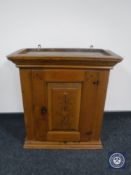 A 19th century pine hanging cabinet