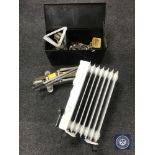 A metal tool box containing screws, car jack,