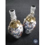 A pair of Imari pattern porcelain table lamps with continental wiring