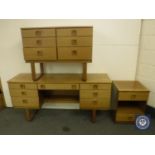 A four-piece Schreiber teak bedroom suite comprising dressing table, six drawer chest,