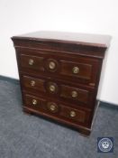 A mid 20th century mahogany three drawer chest