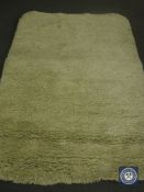 A hand tufted rug, shaggy cream, 160 cm x 230 cm. rrp £513.