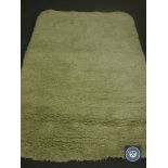 A hand tufted rug, shaggy cream, 160 cm x 230 cm. rrp £513.