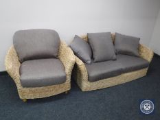 A two seater conservatory settee and armchair