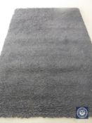 A hand knotted rug, shaggy black, 180 cm 270 cm, rrp £681.