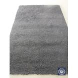 A hand knotted rug, shaggy black, 180 cm 270 cm, rrp £681.