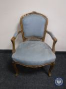 A continental armchair on cabriole legs in blue dralon