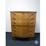 A continental oak serpentine fronted six drawer chest