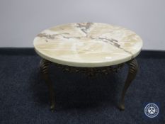 A marble effect circular coffee table on metal legs