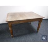 An early 20th century oak dining table