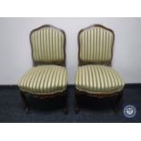 A pair of walnut framed bedroom chairs in Regency style stripe fabric