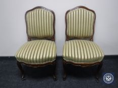 A pair of walnut framed bedroom chairs in Regency style stripe fabric